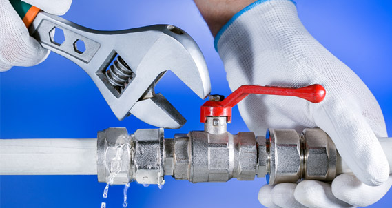 plumber_fixing_pipe Backflow Prevention Lidcombe